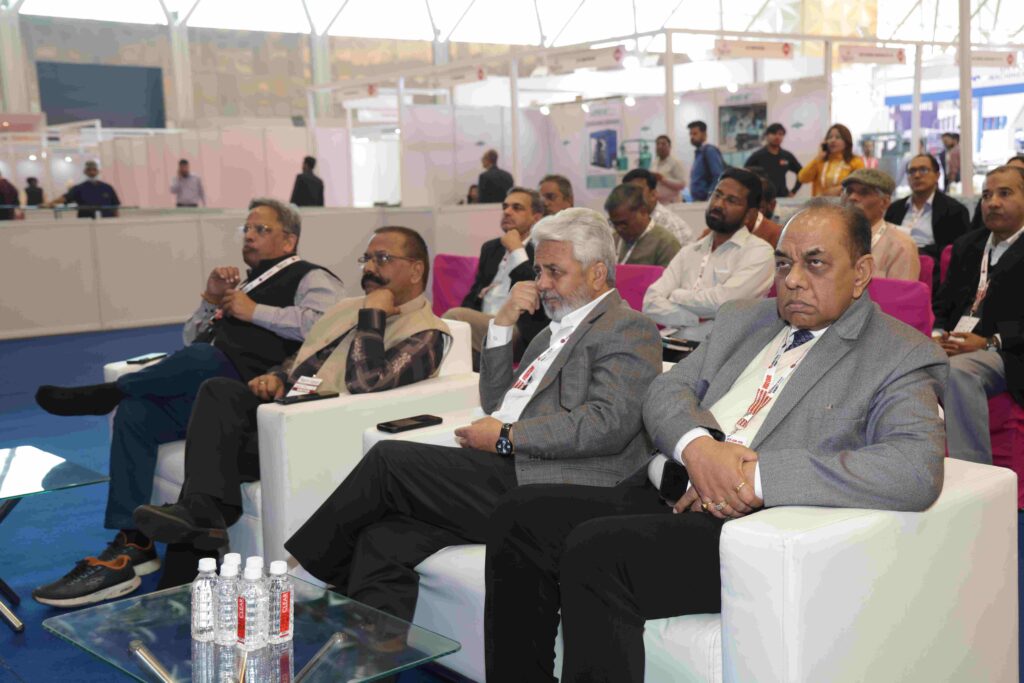 Exhibitors showcasing packaging machines at Corru Pack Print India event