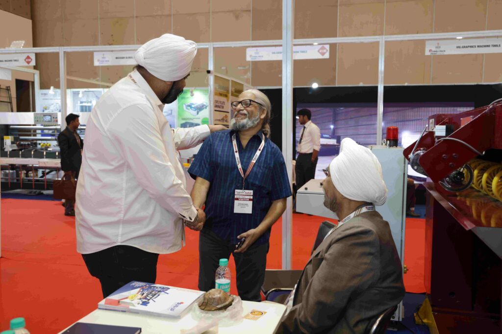 Corrugated box manufacturing machinery display at Corru Pack Print India